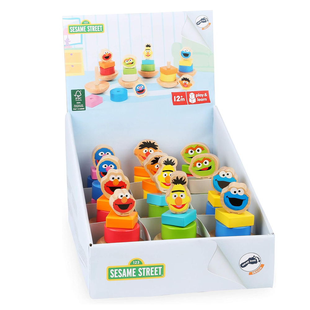 Sesame Street toy set in packaging with character figures and colorful blocks.